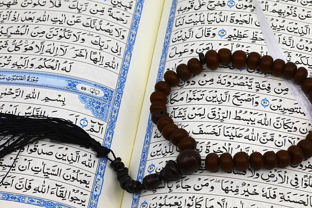 Muslim family reading Quran at home