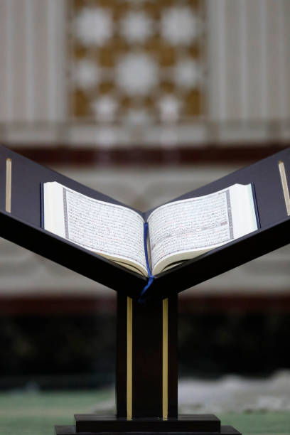 Muslim family learning Quran together in golden light